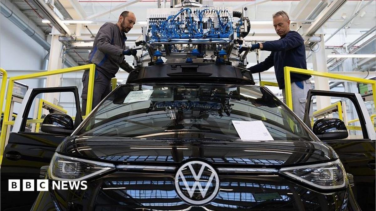Volkswagen board approves plan...
